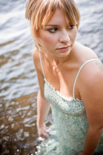 Woman dressed in the water — Stock Photo, Image