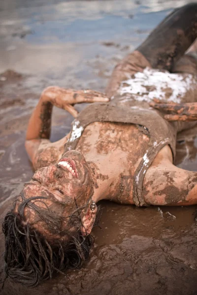 Woman in the mud — Stock Photo, Image