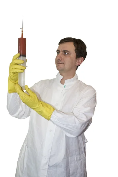 Médico con una jeringa en las manos . Imagen de archivo