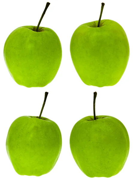 Vier grüne Apfel golden — Stockfoto