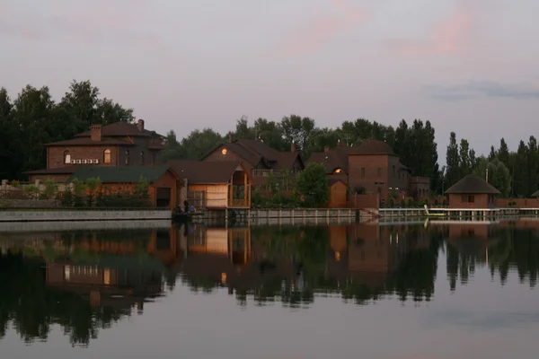 stock image Pretty house reflected in water