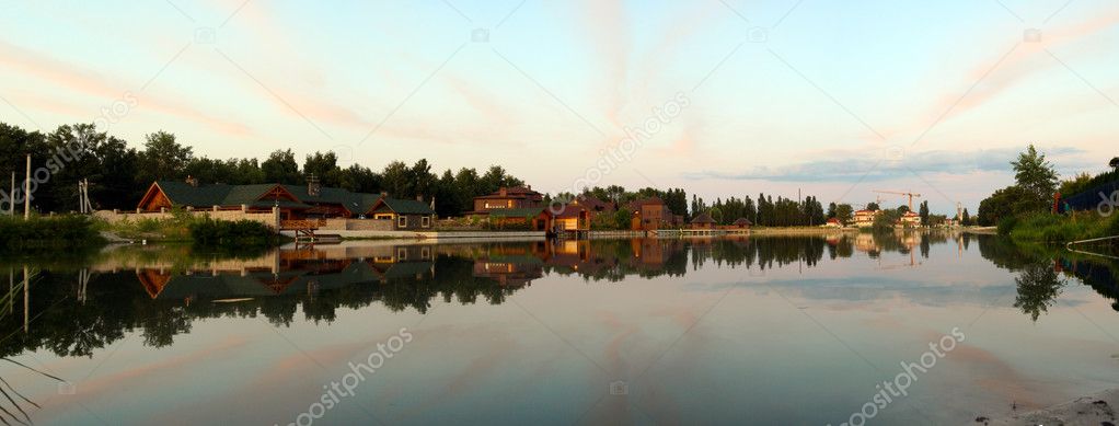 Rural calm panorama reflected in water