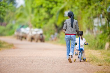 Mother and daughter on the road clipart