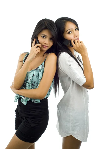 Pretty asians with mobile phones — Stock Photo, Image