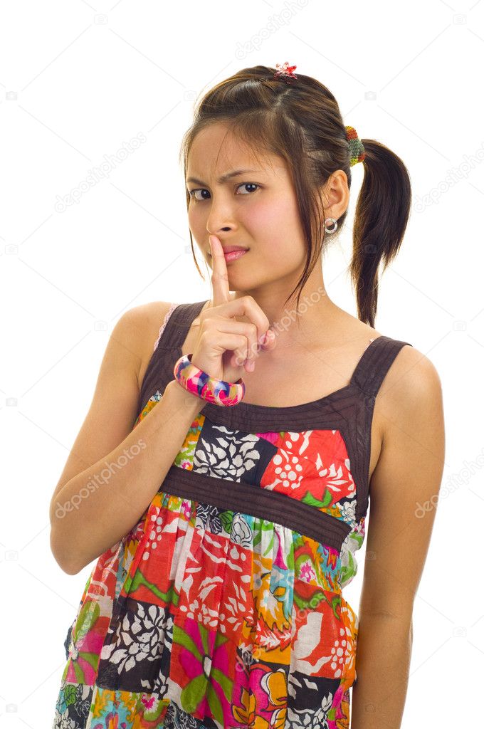 Asian woman with finger on her lips