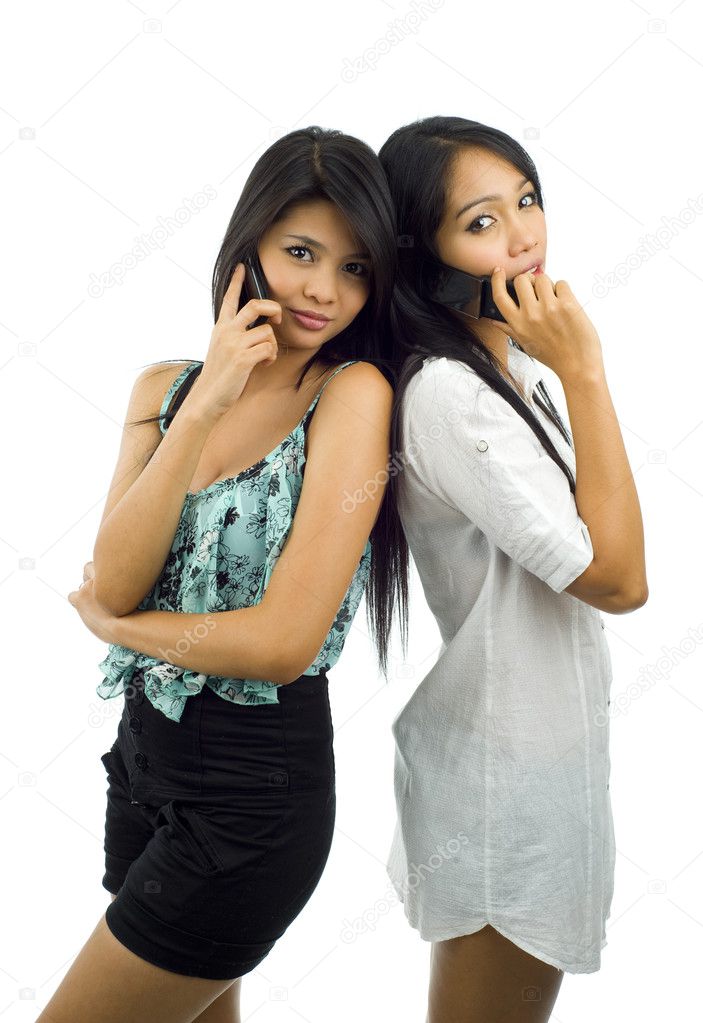 Pretty asians with mobile phones