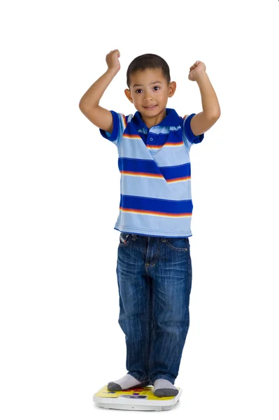 Young boy on scale — Stock Photo, Image