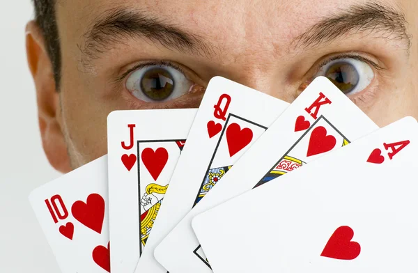 Man hiding behind cards — Stock Photo, Image
