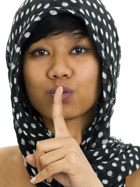 Женщина с пальцем на губах Стоковое Фото
