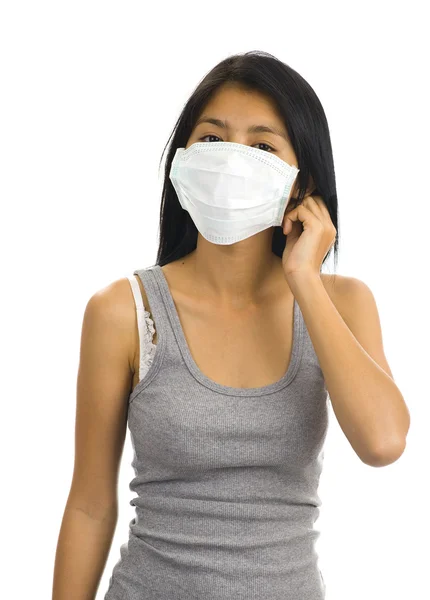 Aziatische vrouw met een gezichtsmasker — Stockfoto