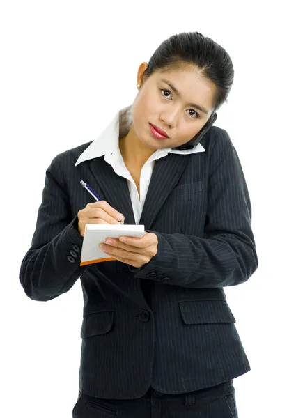 Business woman on the phone taking notes — Stock Photo, Image