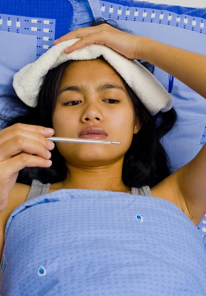 Stock image Pretty young woman sick in bed