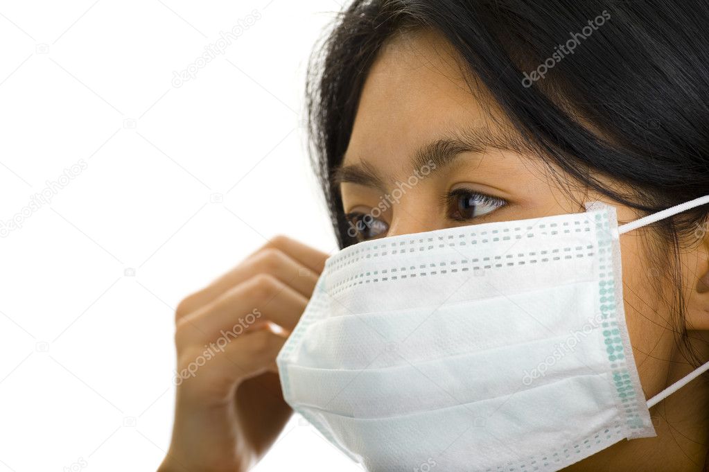 Woman putting on a face mask