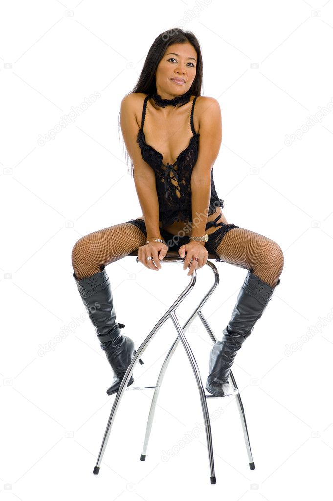 Woman in her 30s posing in black lingerie