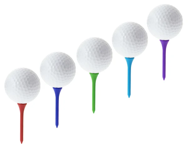 Golfbollar på tees — Stockfoto