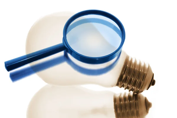 Magnifying Glass and Light Bulb — Stock Photo, Image
