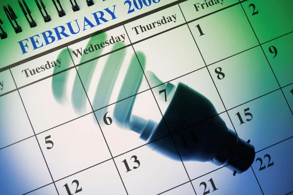 Fluorescent Bulb and Calendar — Stock Photo, Image