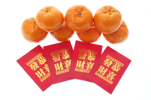 Mandarinas y paquetes rojos — Foto de Stock