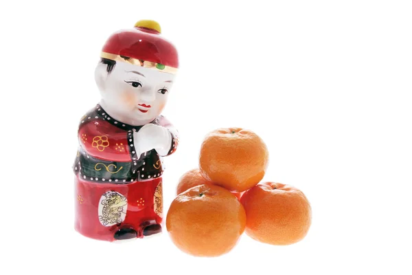 Chinese Figurine and Mandarins — Stock Photo, Image