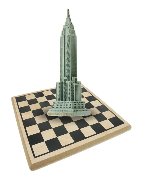 Satranç tahtası ve empire state Binası — Stok fotoğraf