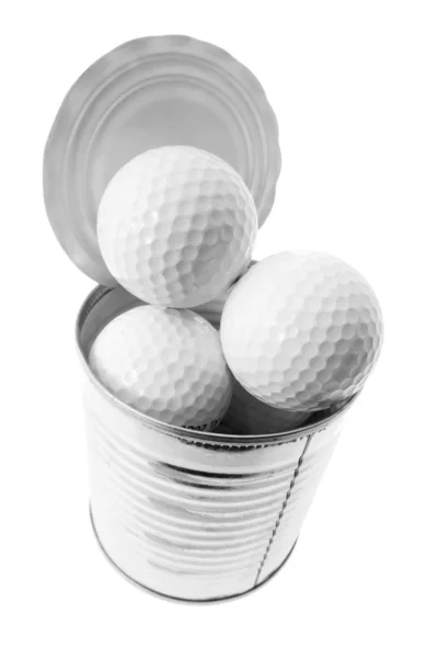 Golfbälle in Blechdose lizenzfreie Stockfotos