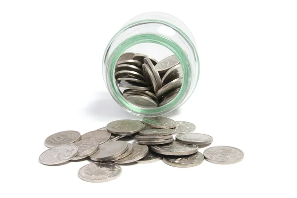 Piggybank y monedas en tarro de cristal — Foto de Stock