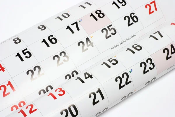 Часы и страницы календаря — стоковое фото
