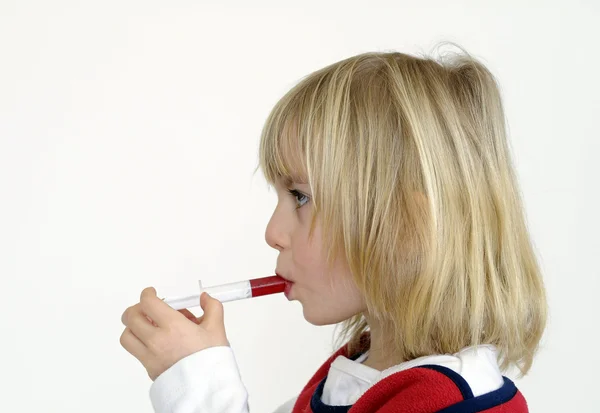 Little girl takes medicine — Stock Photo, Image