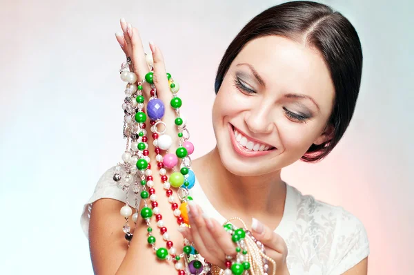 Woman with beads — Stock Photo, Image
