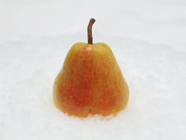 Pear on a snow — Stock Photo, Image