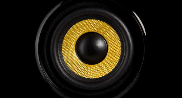 A yellow speaker on black