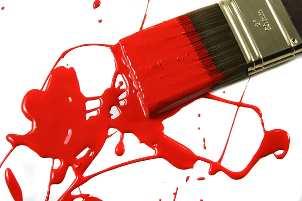 Una superficie bianca disordinata con vernice rossa spi Foto Stock Royalty Free