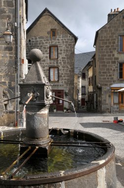 Fountain of Besse en Chandesse in France clipart