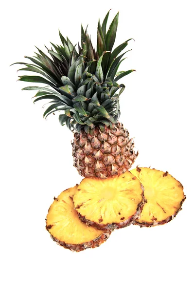 Cut pineapple against a white background — Stock Photo, Image