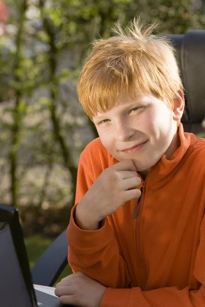 Young boy with laptop — Stock Photo, Image