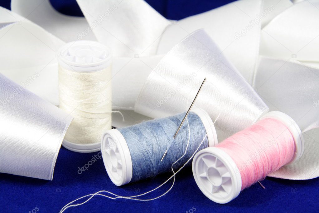 Thread with needle and ribbon — Stock Photo © nataliia 2557842