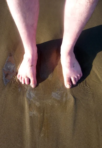 Feet in sand — Stock Photo, Image