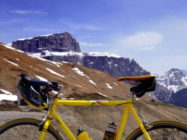 With a road bike in the mountains clipart