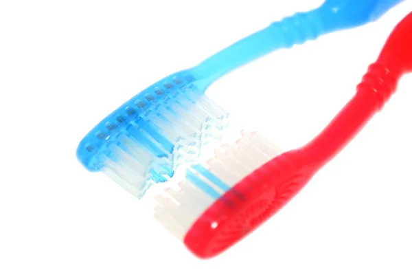 Diş fırçası mavi ve kırmızı. — Stok fotoğraf