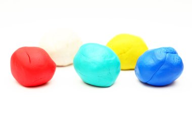 Colored plasticine on white background. clipart