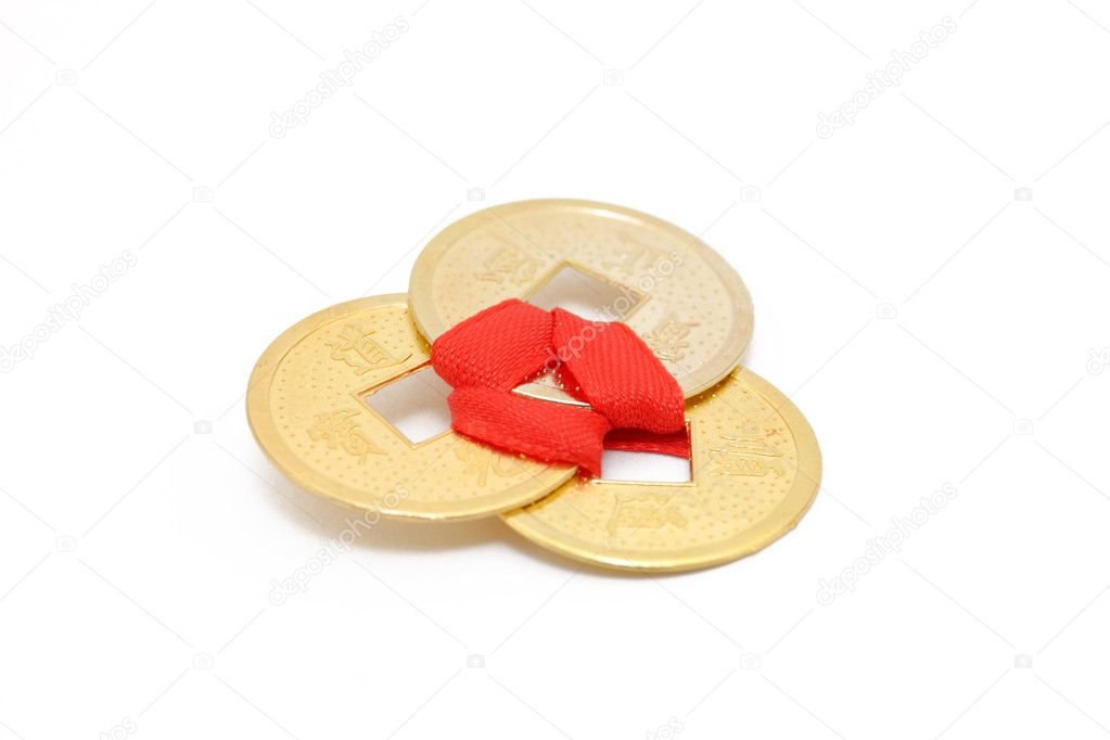 Chinese coins with red ribbon. Symbol of
