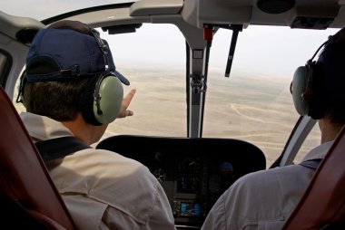 Pilots in helicopter cabin
