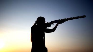 Shooting with a gun silhouette