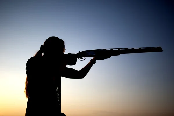 Sparatoria con una silhouette di pistola — Foto Stock