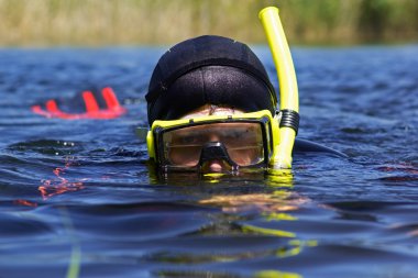 Underwater diver in lake clipart