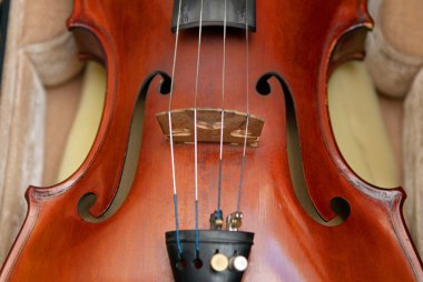 Violin in case close-up clipart