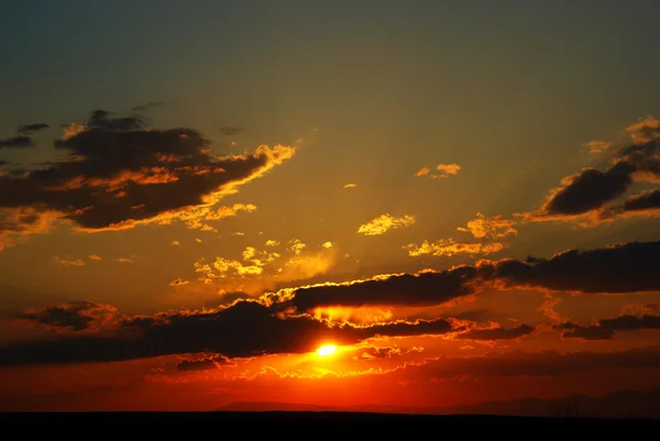Sundown in clouds — Stock Photo, Image