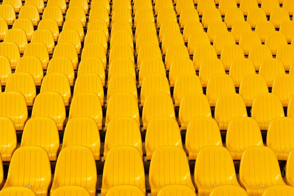 Fondo de asientos de estadio amarillo —  Fotos de Stock