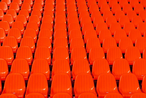Estádio vermelho assentos fundo — Fotografia de Stock