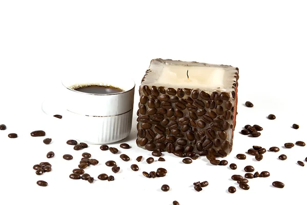 Чашка кофе и свеча — стоковое фото